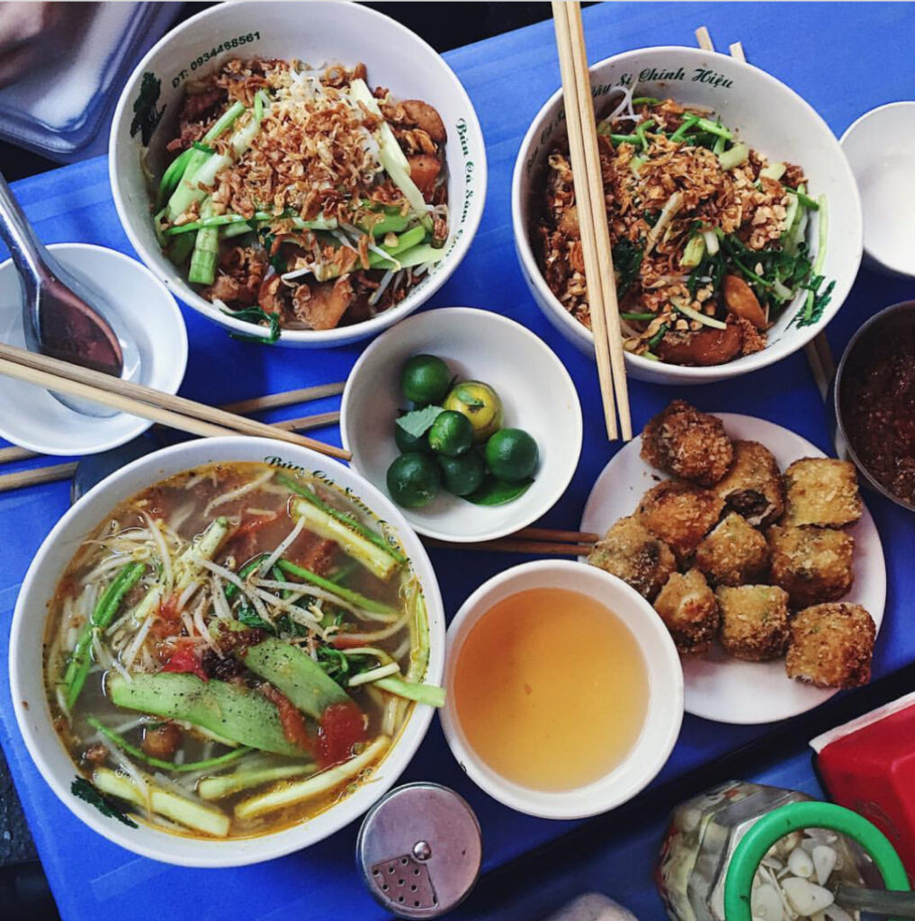 a bowl filled with different types of food on a table