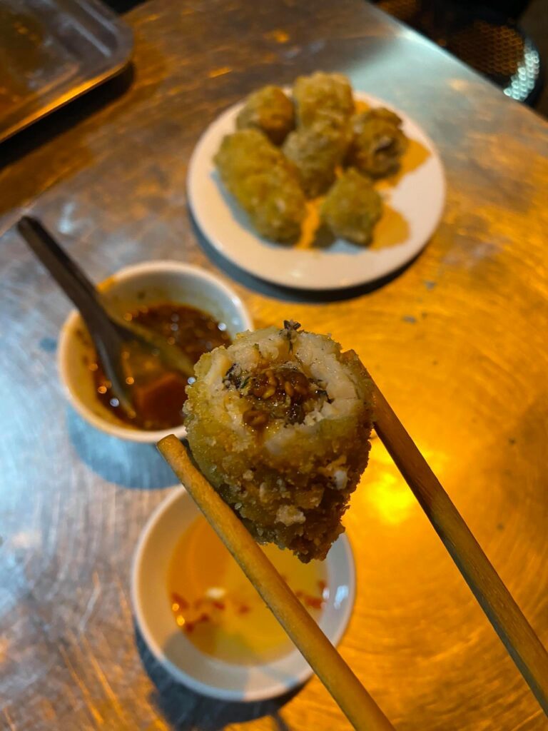 a plate of food and a spoon on a table