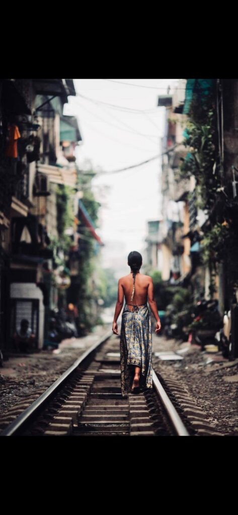 a man riding a skateboard down a sidewalk
