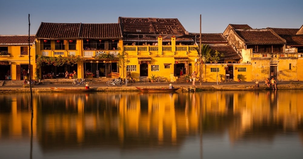 a small house surrounded by water