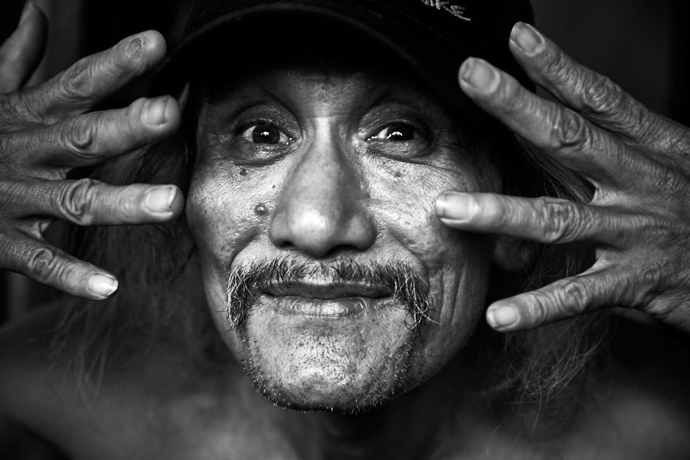 a close up of a man making a face for the camera