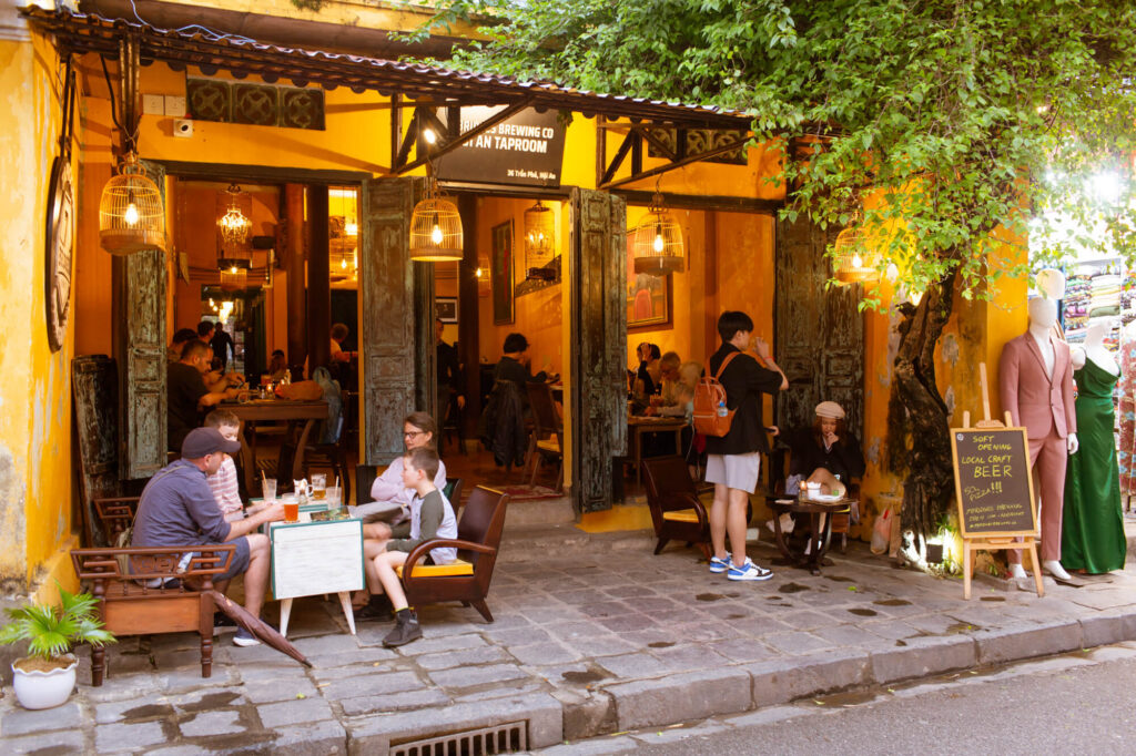 a group of people sitting at a table in a restaurant