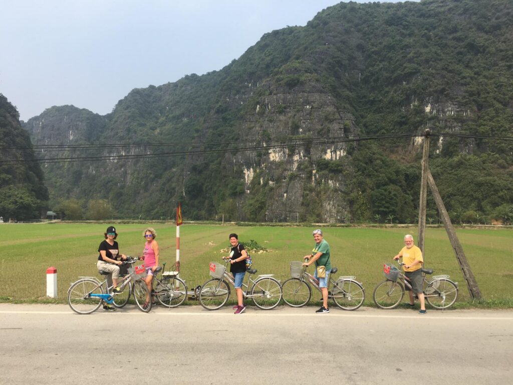 a group of people riding on the back of a motorcycle