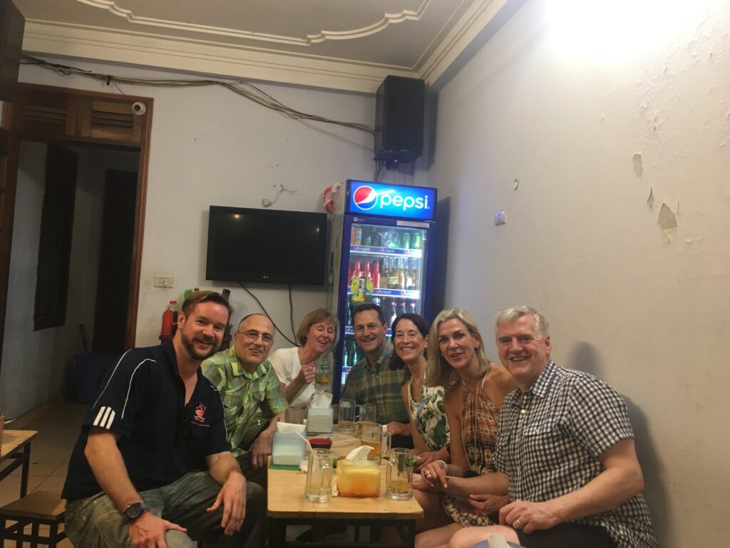 a group of people sitting at a table