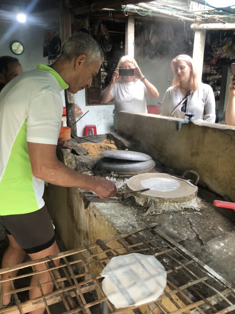 a person cooking in a kitchen preparing food