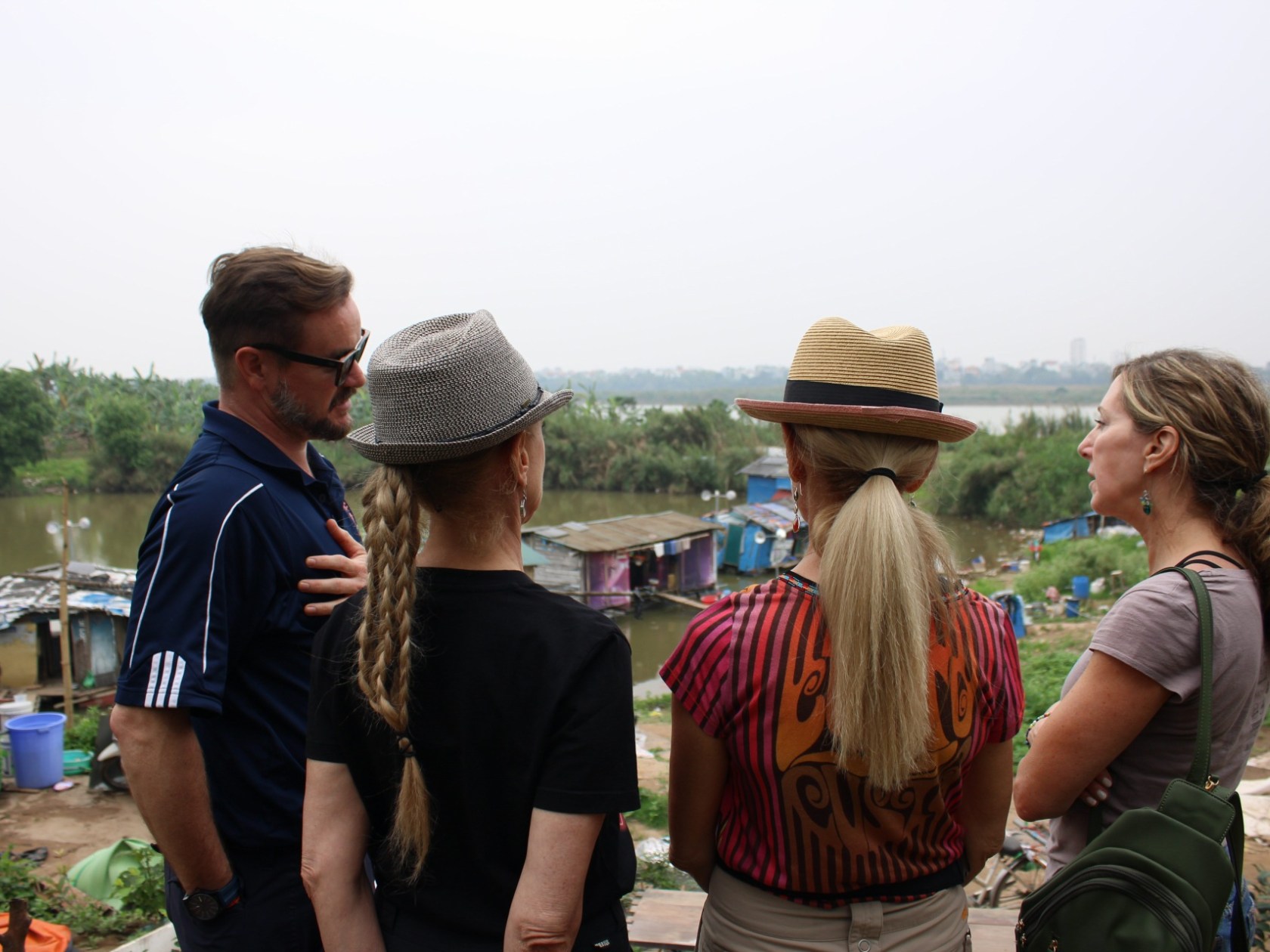 a group of people looking at a phone
