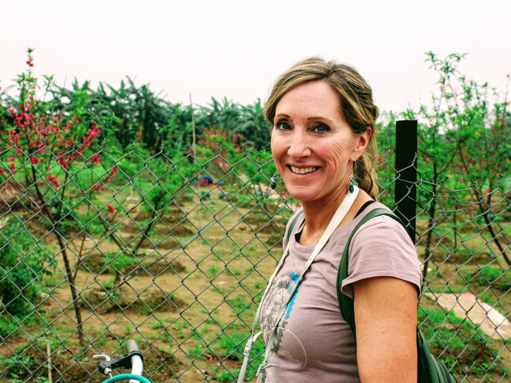 a person standing in front of a fence