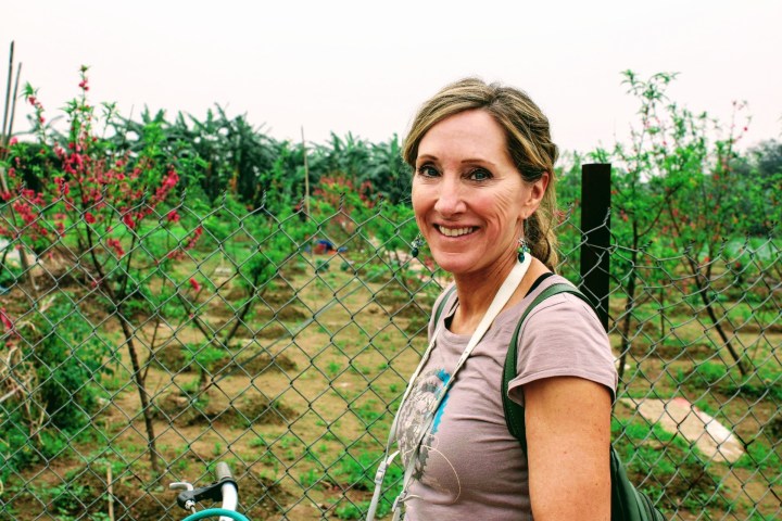 a person standing in front of a fence
