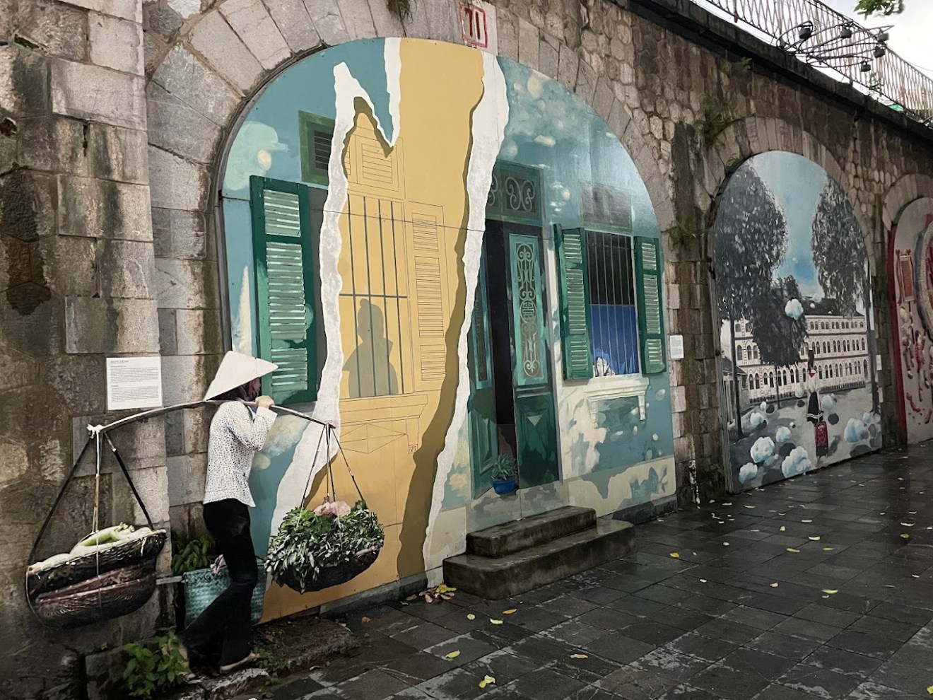 a stone building that has graffiti on the wall