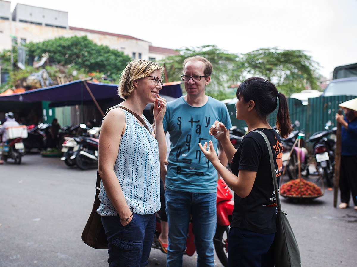 a couple of people that are standing in the street
