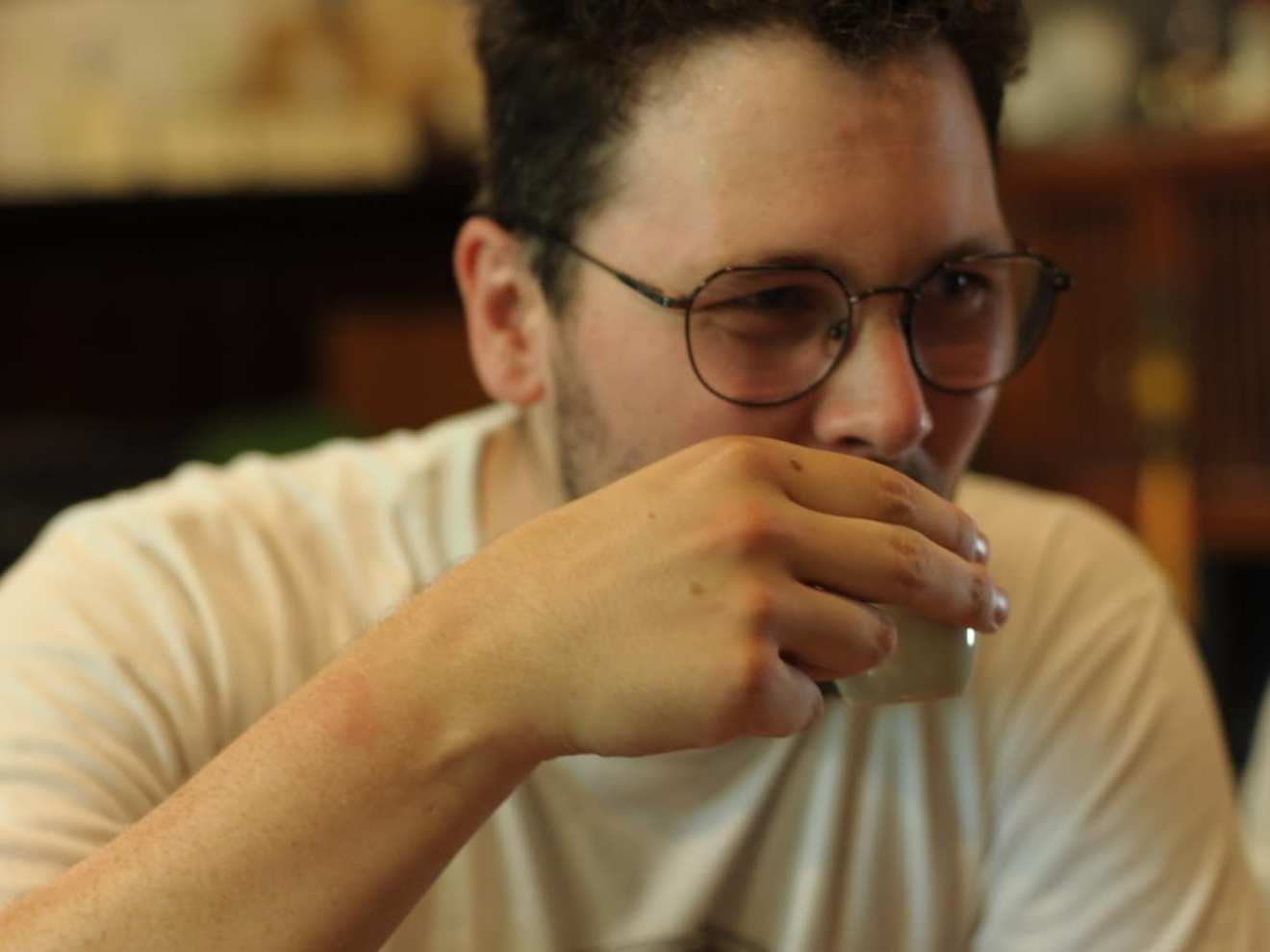 a man sitting at a table eating food