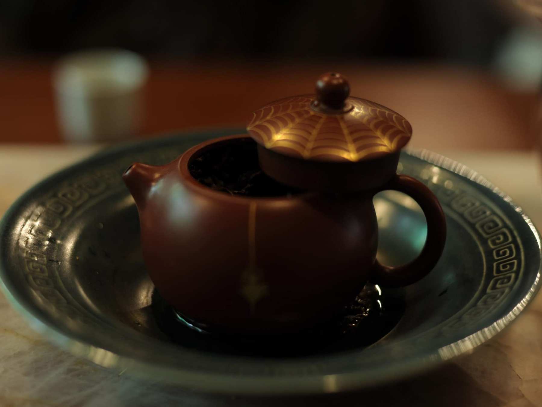a close up of a coffee cup sitting on a table