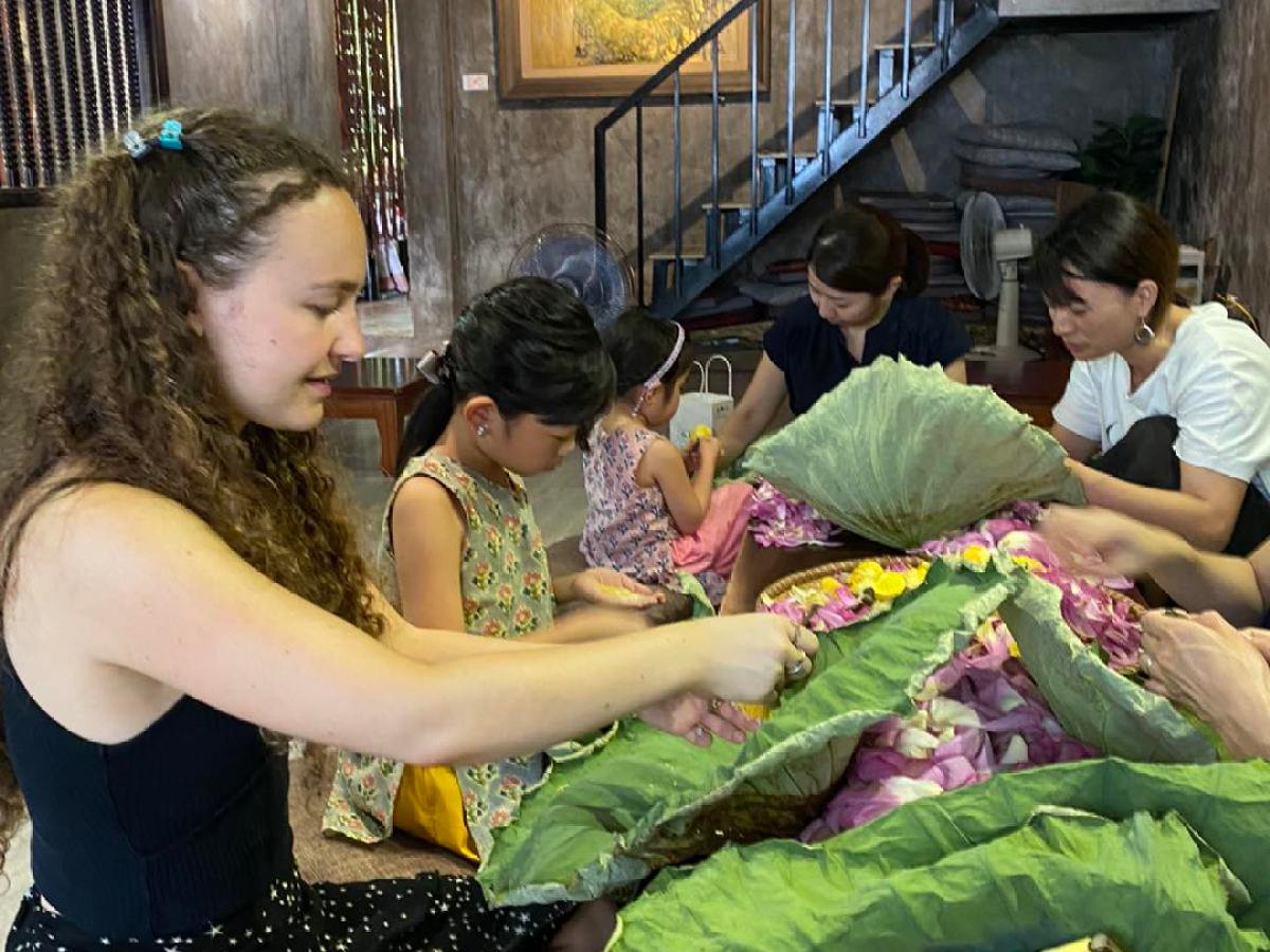 a woman sitting on a table