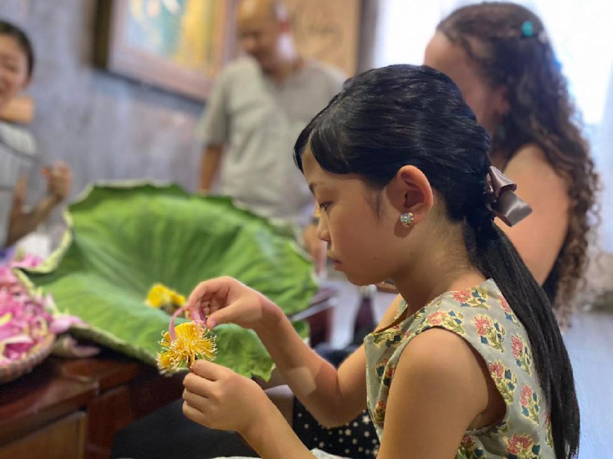 a woman sitting on a table