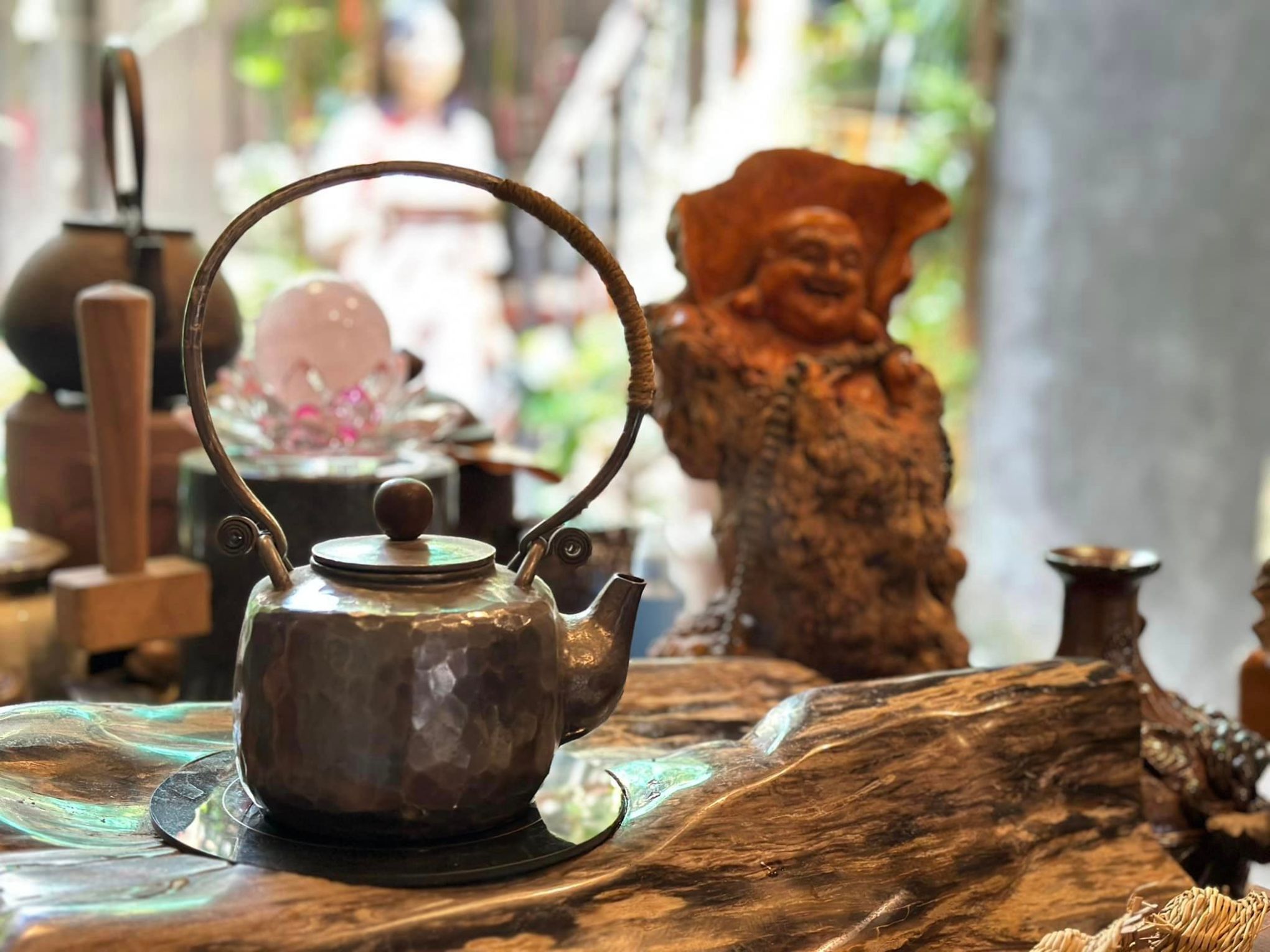 a vase sitting on top of a wooden table
