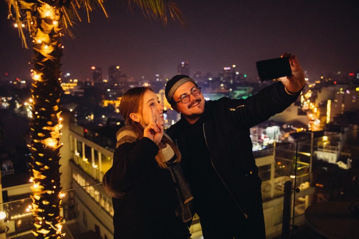 a man that is lit up at night