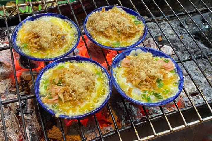 a bowl of food on a grill