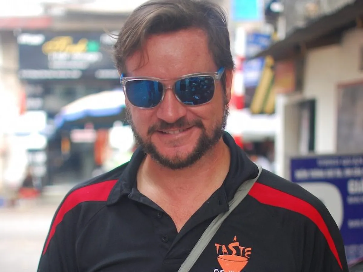 a man holding a plate of food