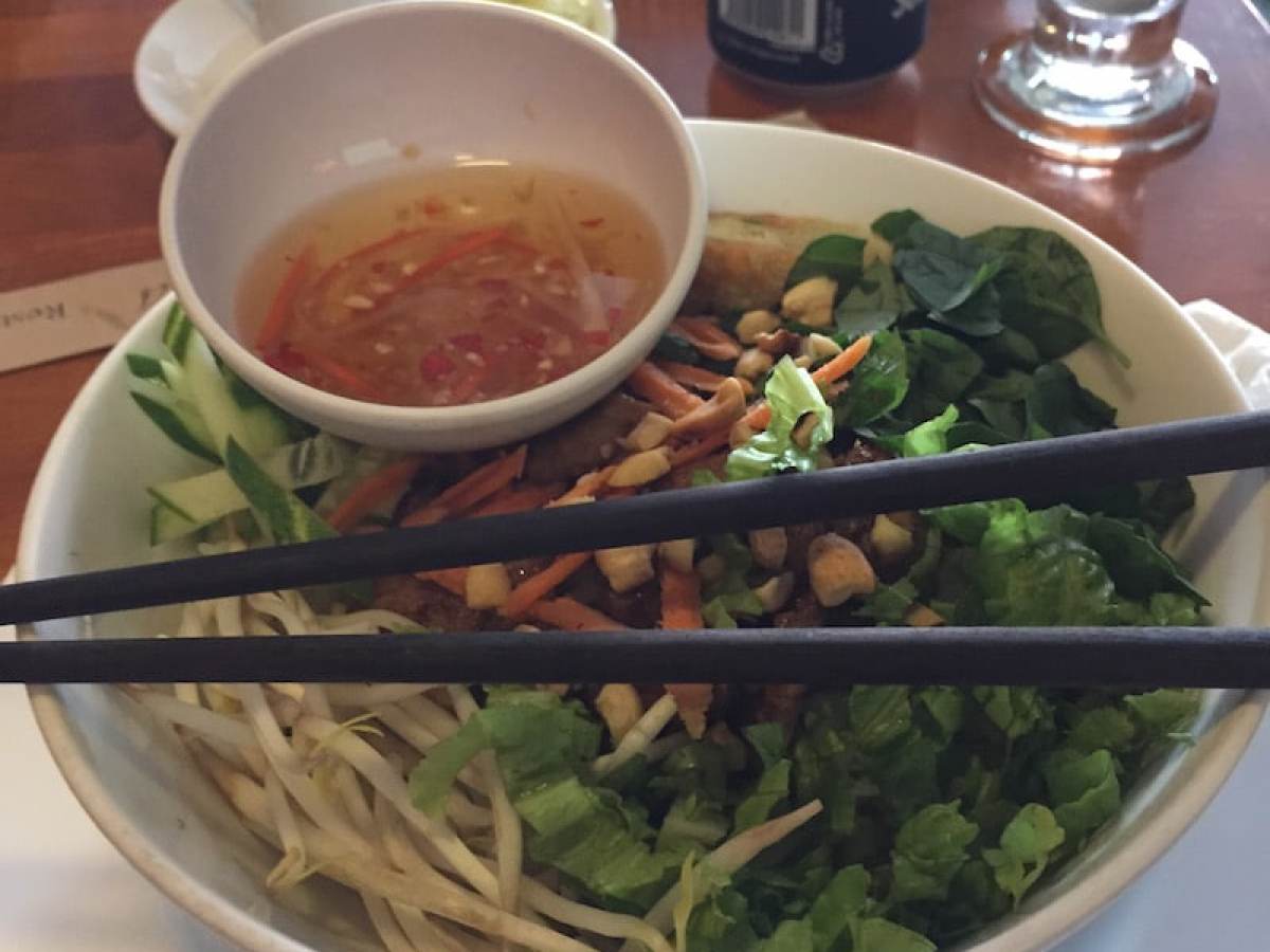 a bowl of food on a plate on a table
