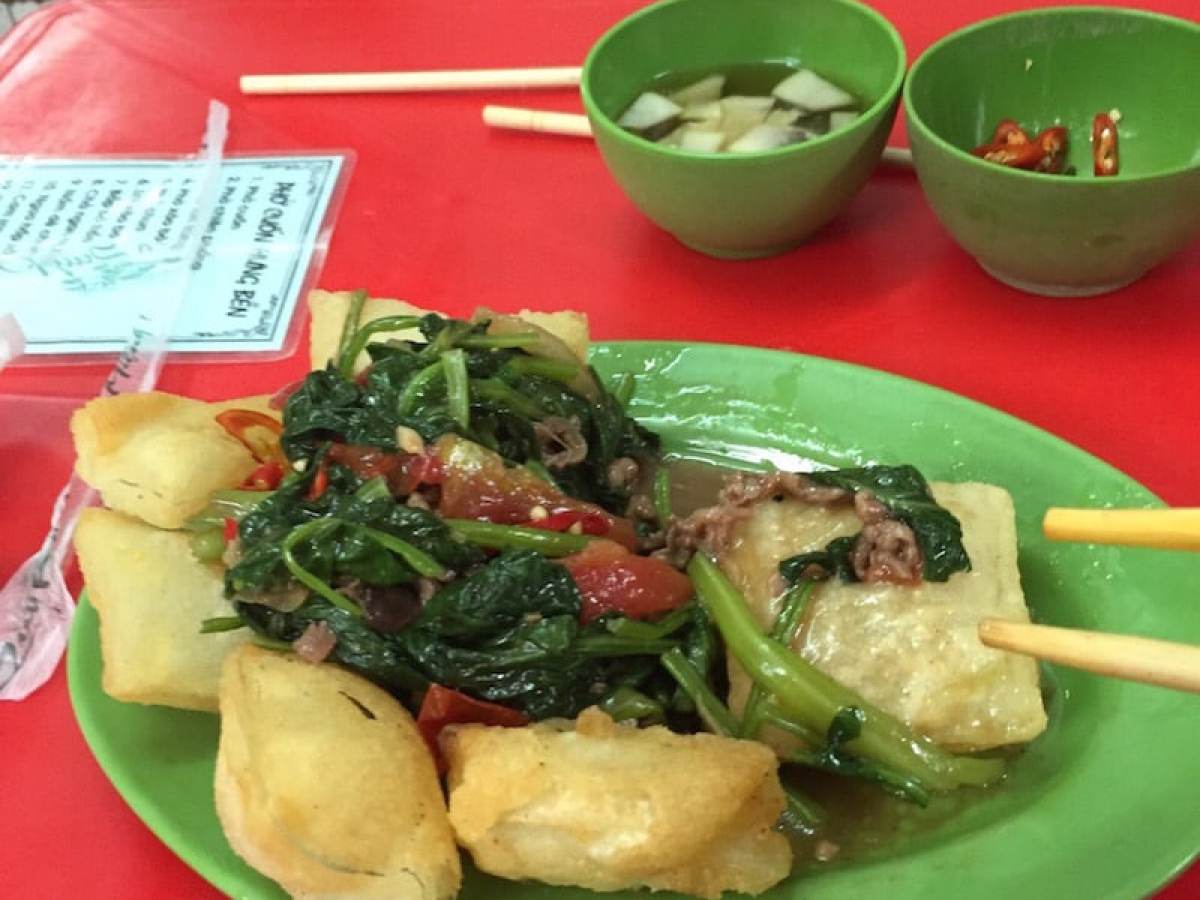 a plate of food on a red table