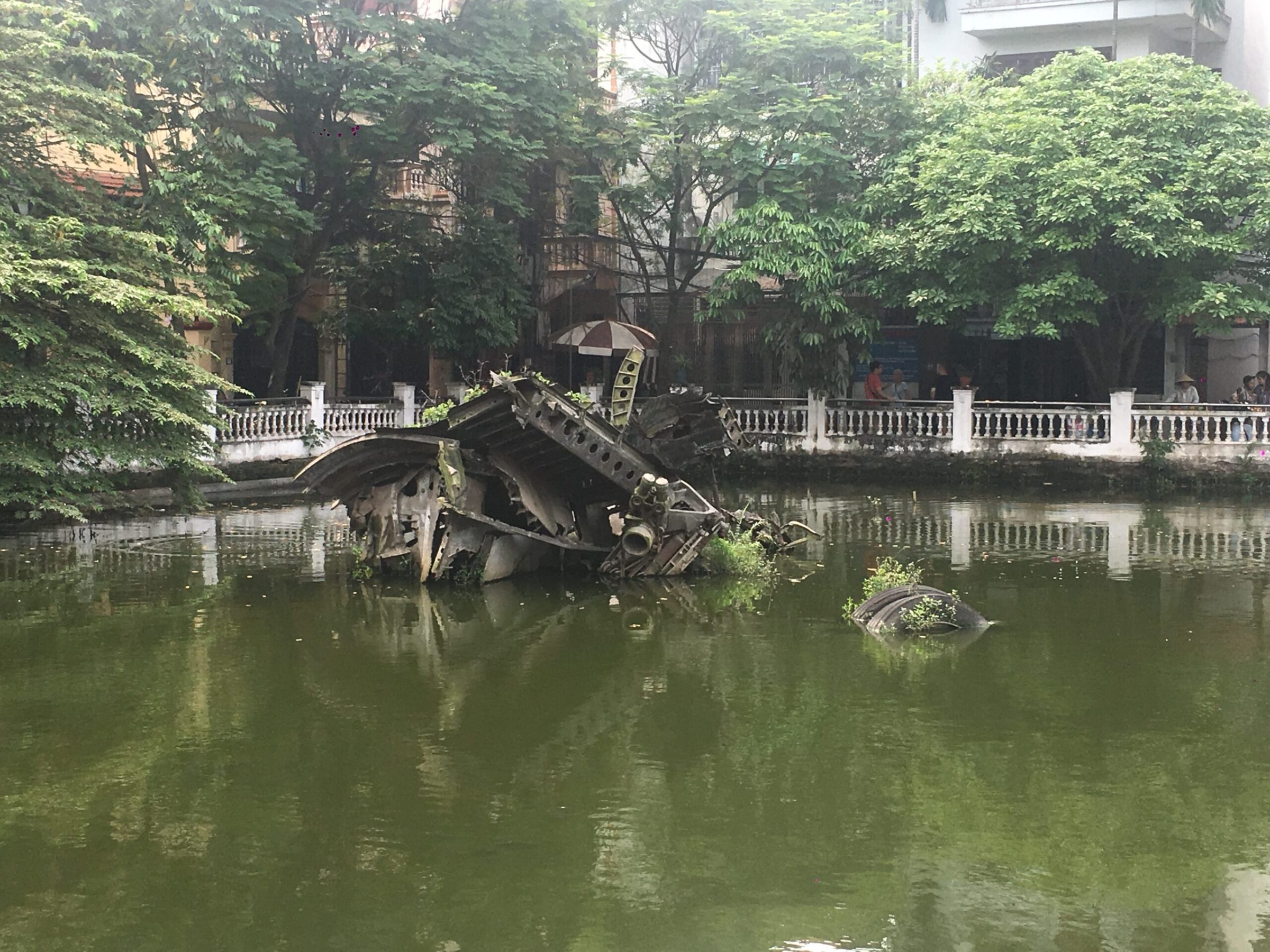 a bridge over a body of water surrounded by trees