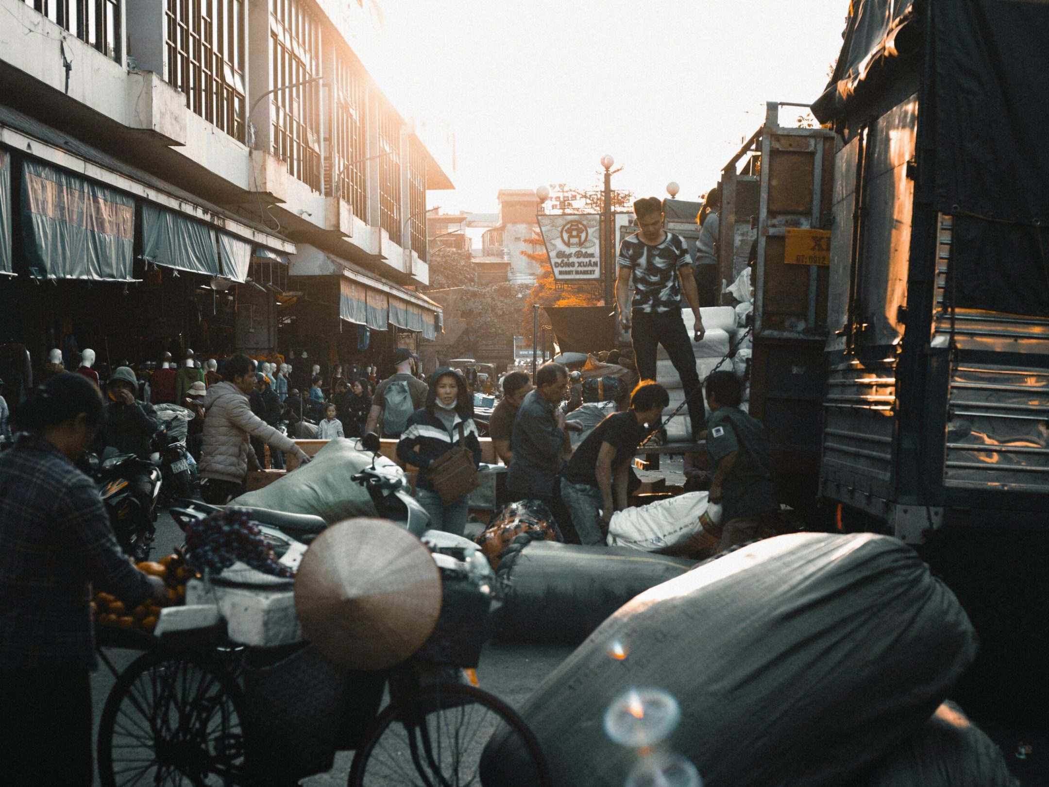 a group of people riding motorcycles on a city street