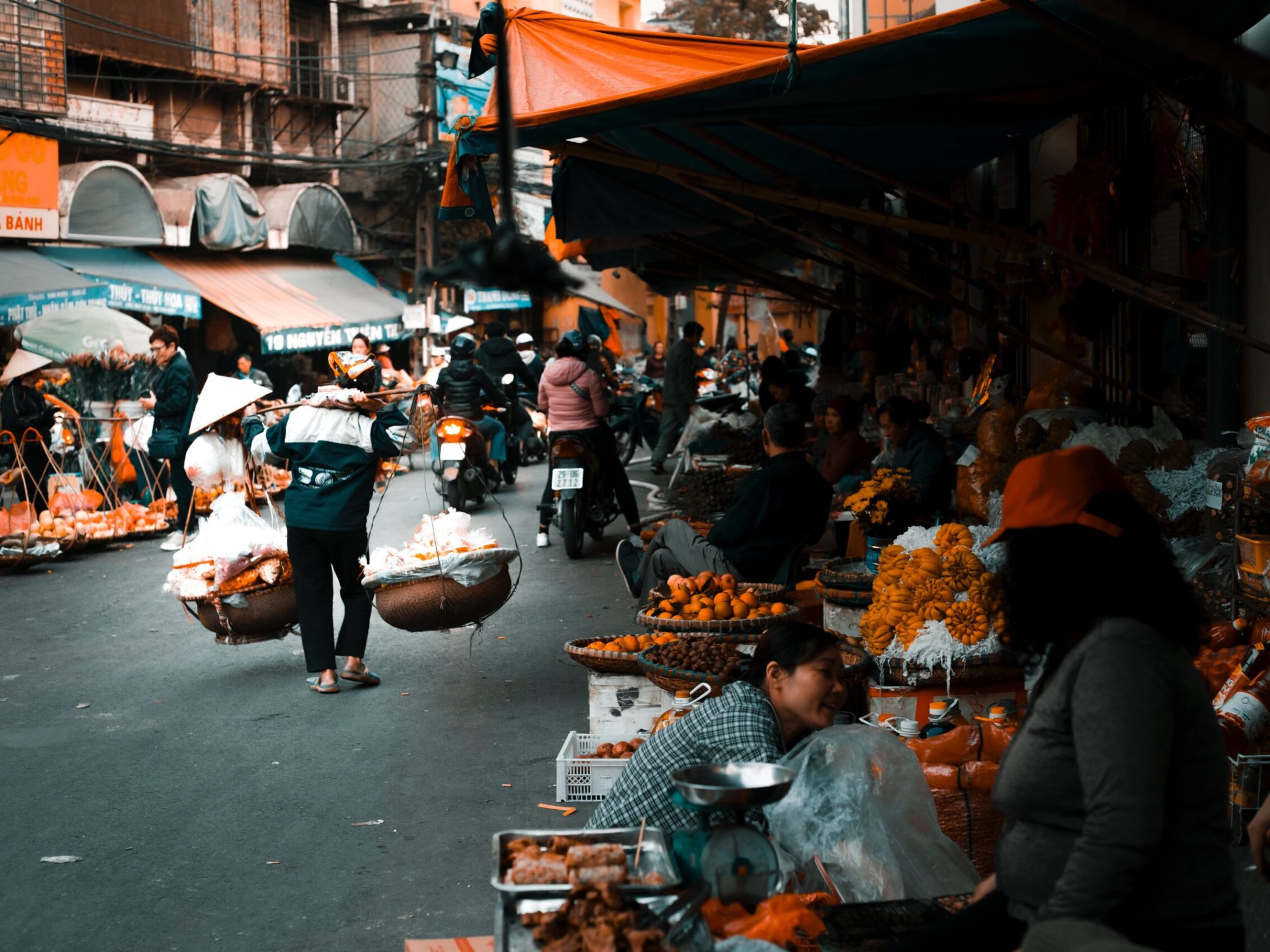 a group of people sitting at a crowded street