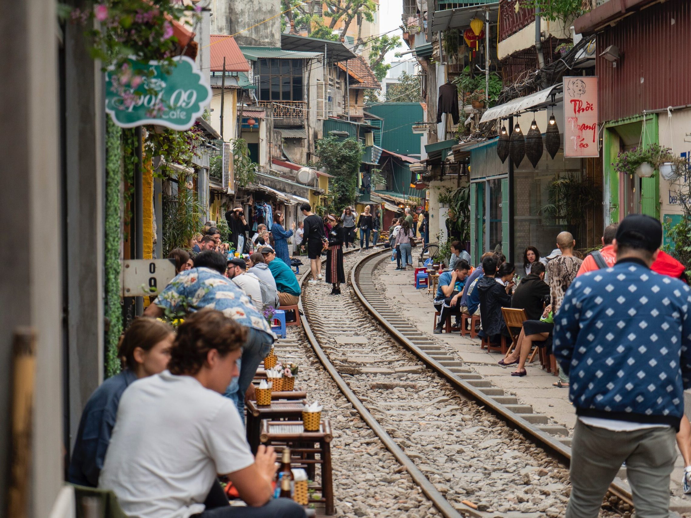 a group of people walking down a street