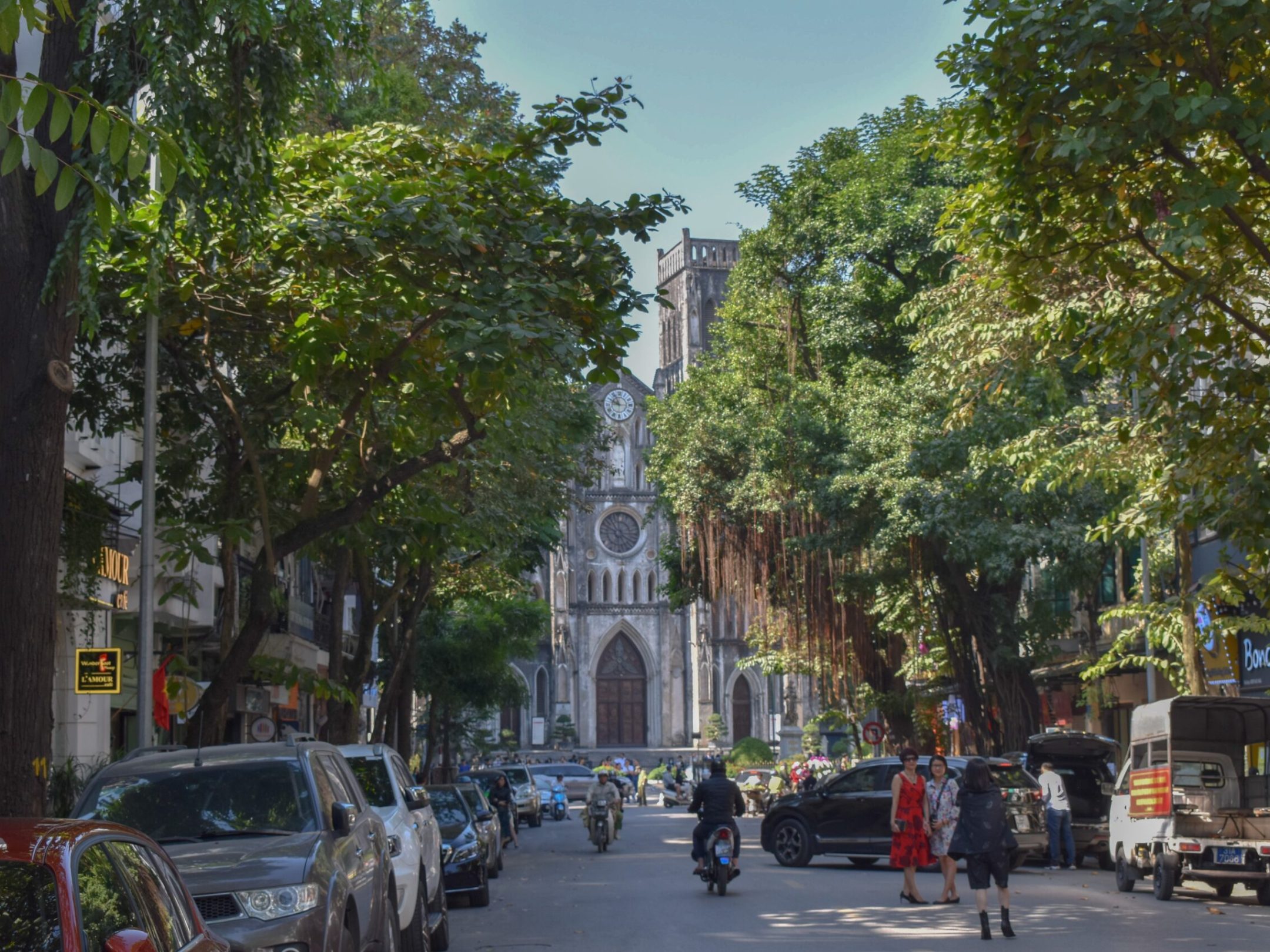 a group of people walking on a city street