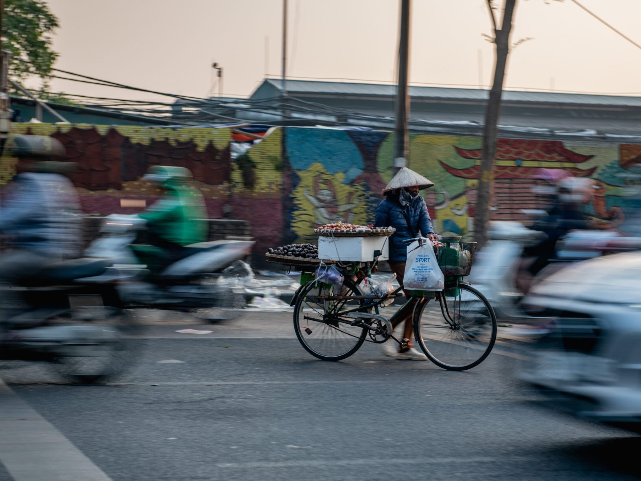 a person riding a bicycle on a city street