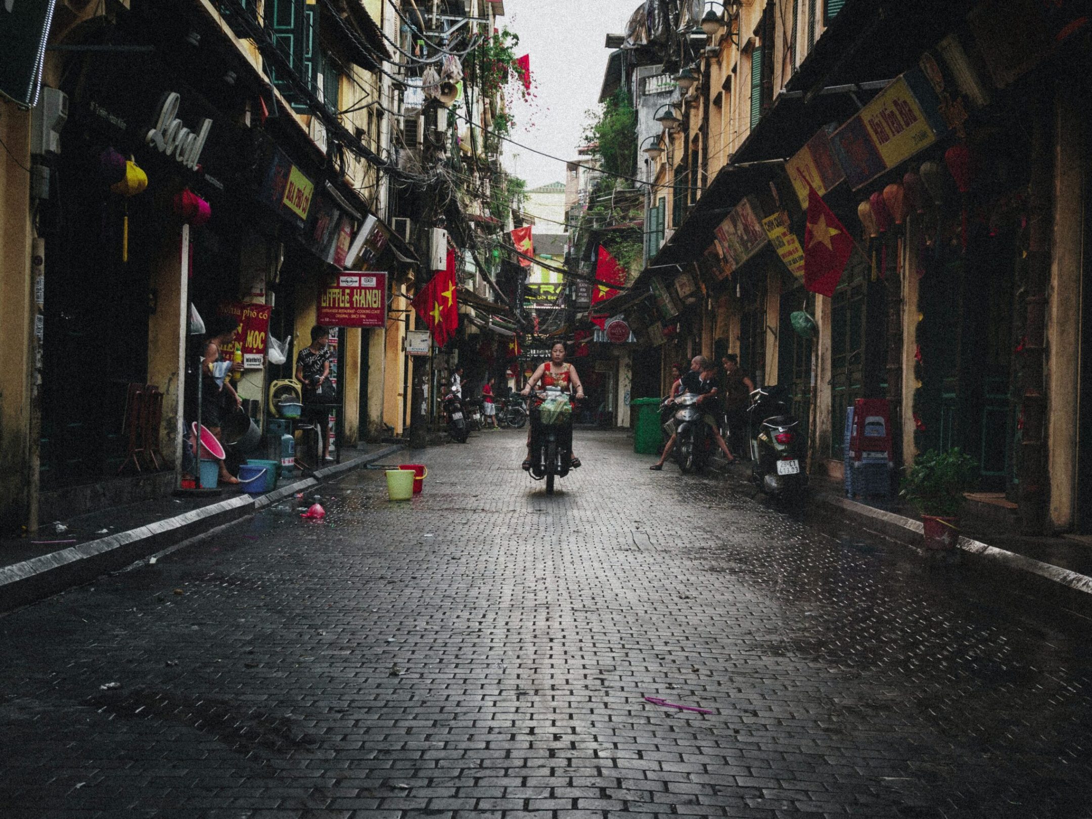 a group of people walking down the street