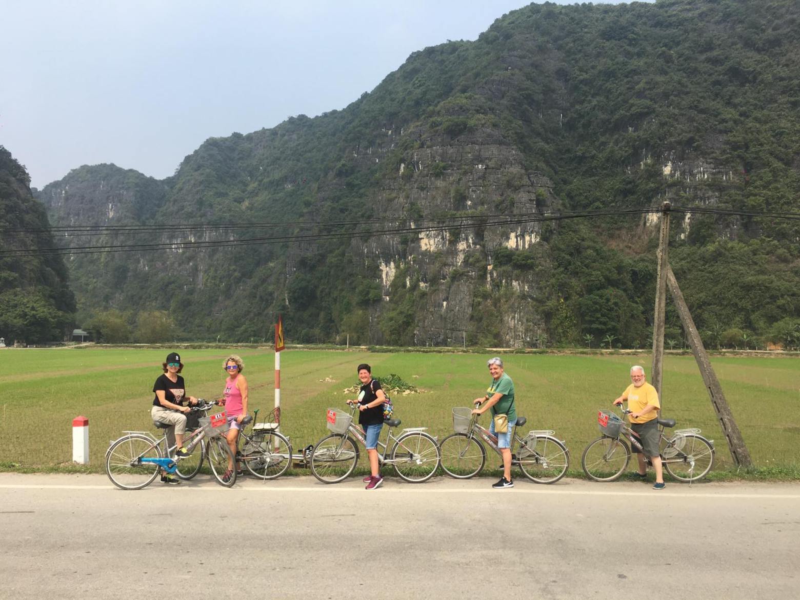 a group of people riding on the back of a motorcycle