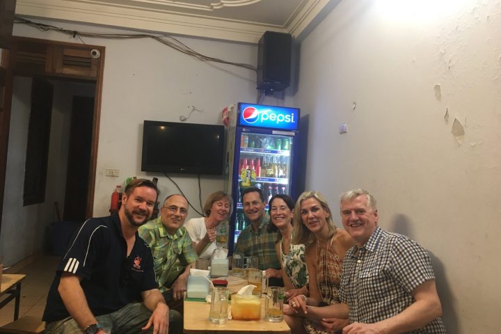 a group of people sitting at a table