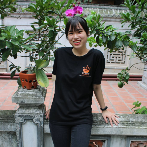 a woman standing in front of a building