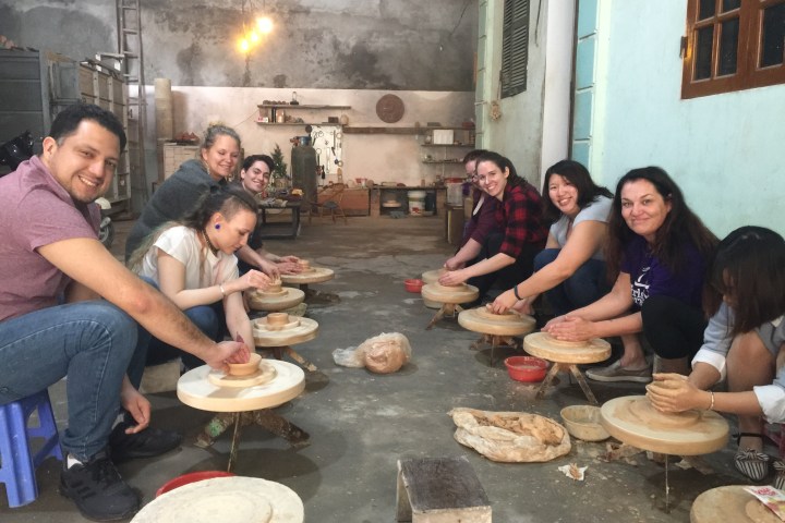 sitting at a table with food