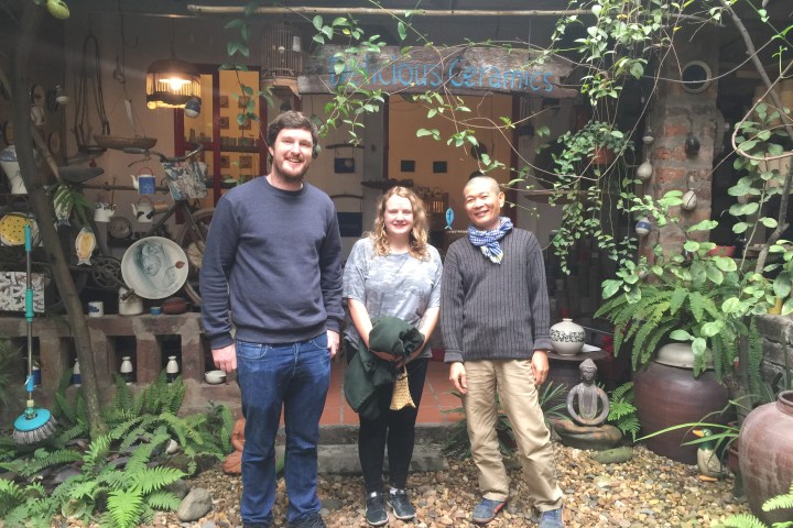 a group of people standing in front of the camera
