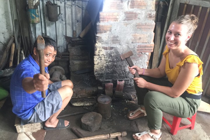 a woman sitting on a bench