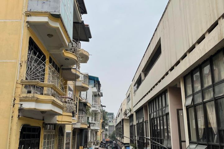 a group of people standing in front of a building