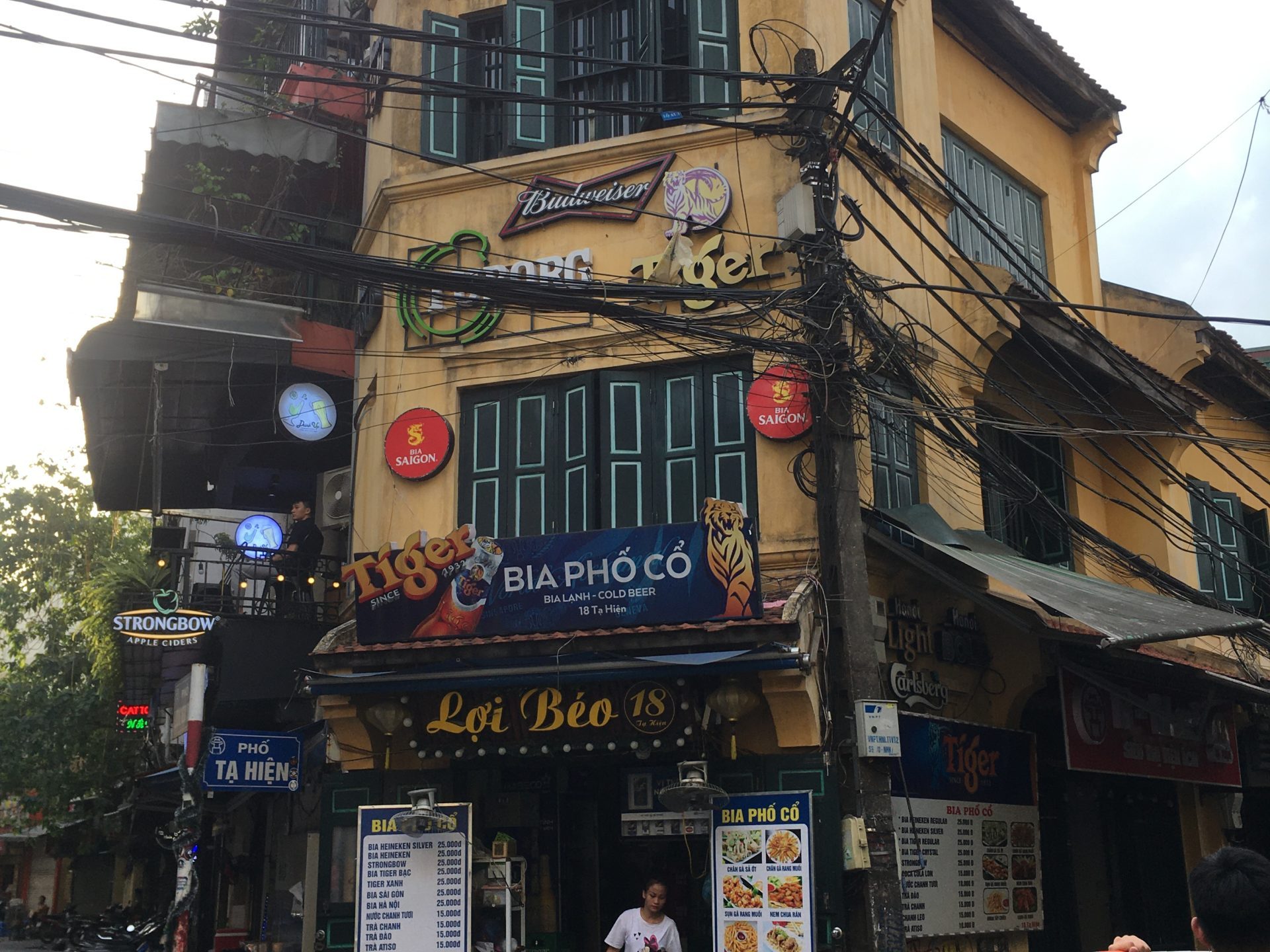 a group of people walking on a city street
