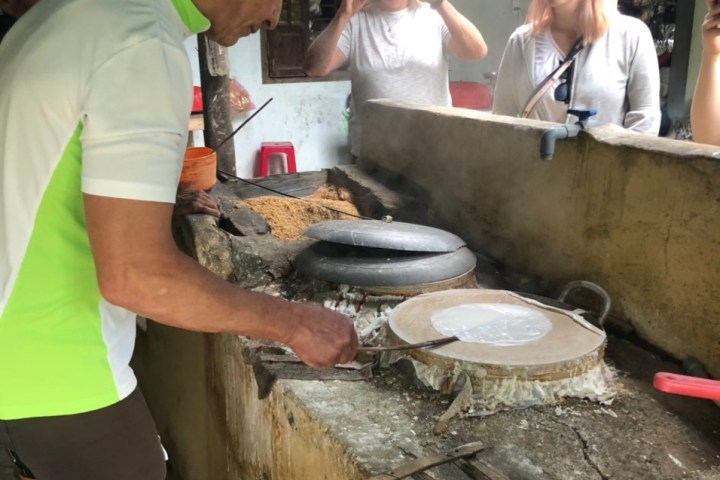 a person cooking in a kitchen preparing food