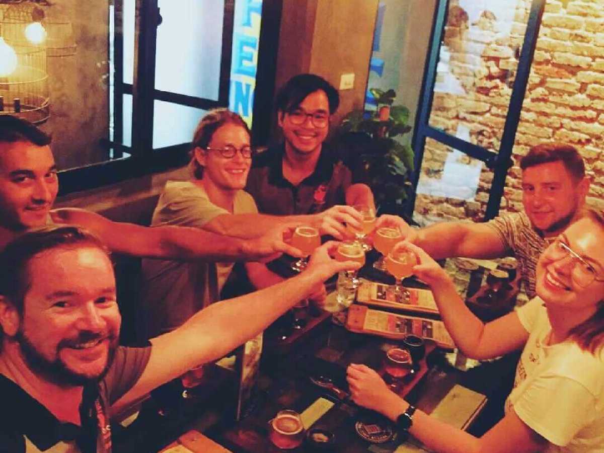a group of people sitting at a table posing for the camera