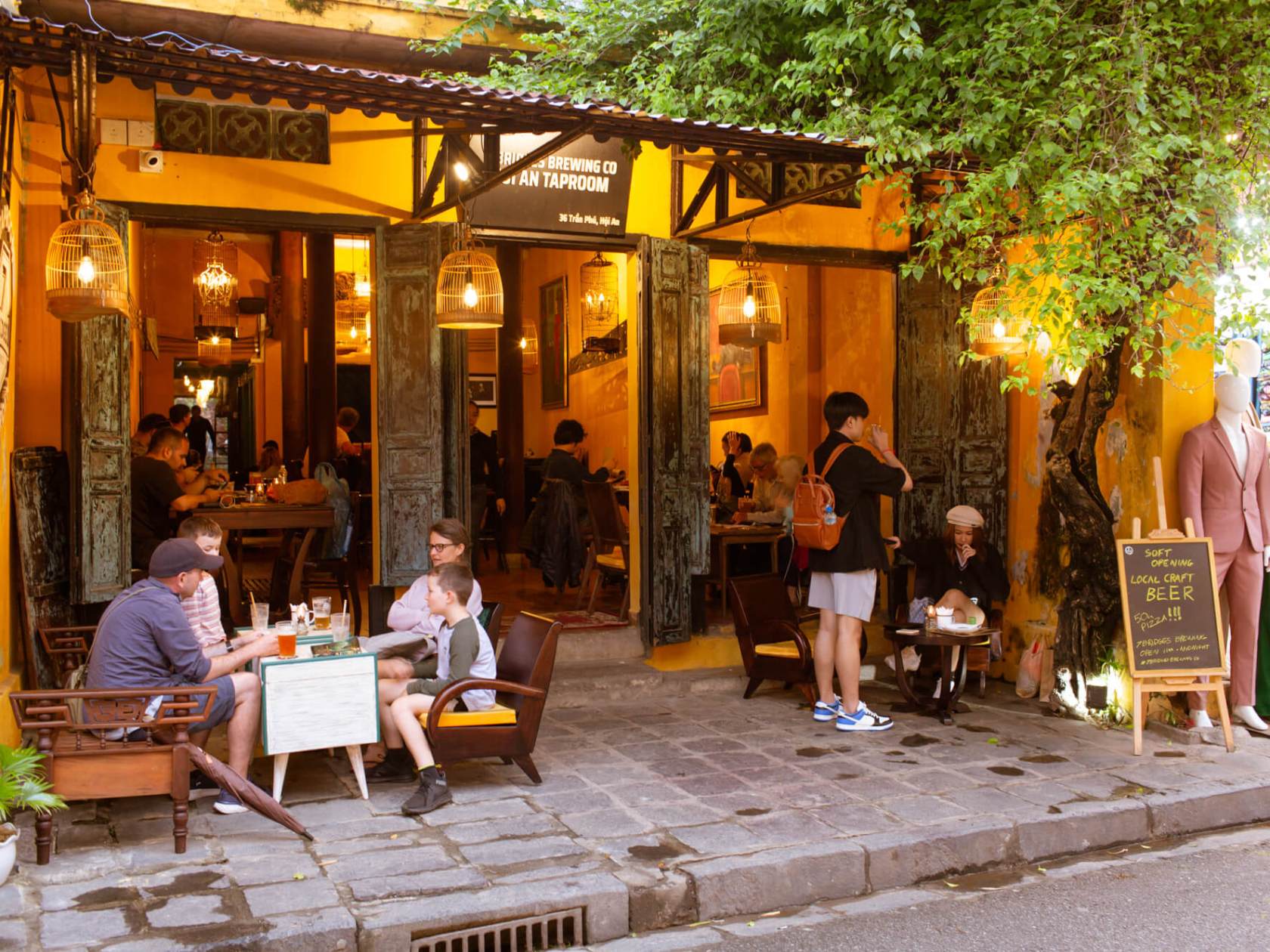 a group of people sitting at a table in a restaurant