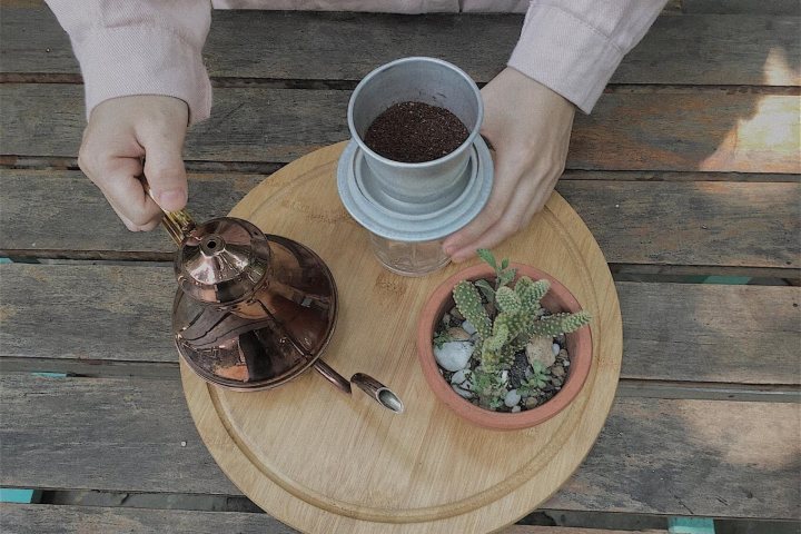 a person holding a plate of food