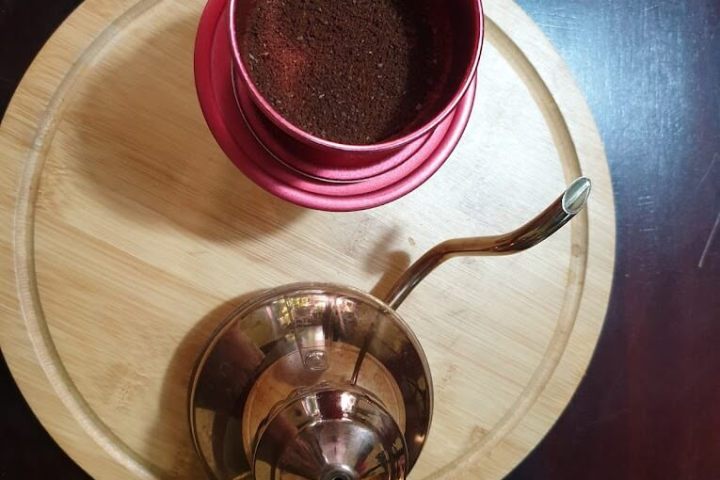 a cup of tea sitting on top of a wooden table