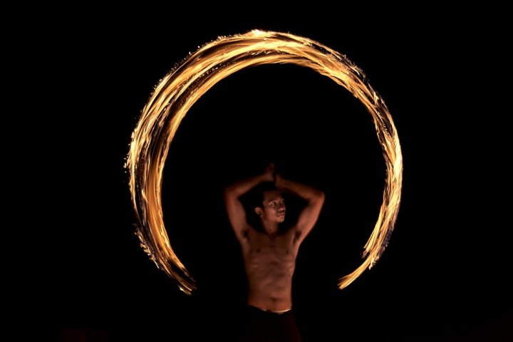 a person that is standing in the dark