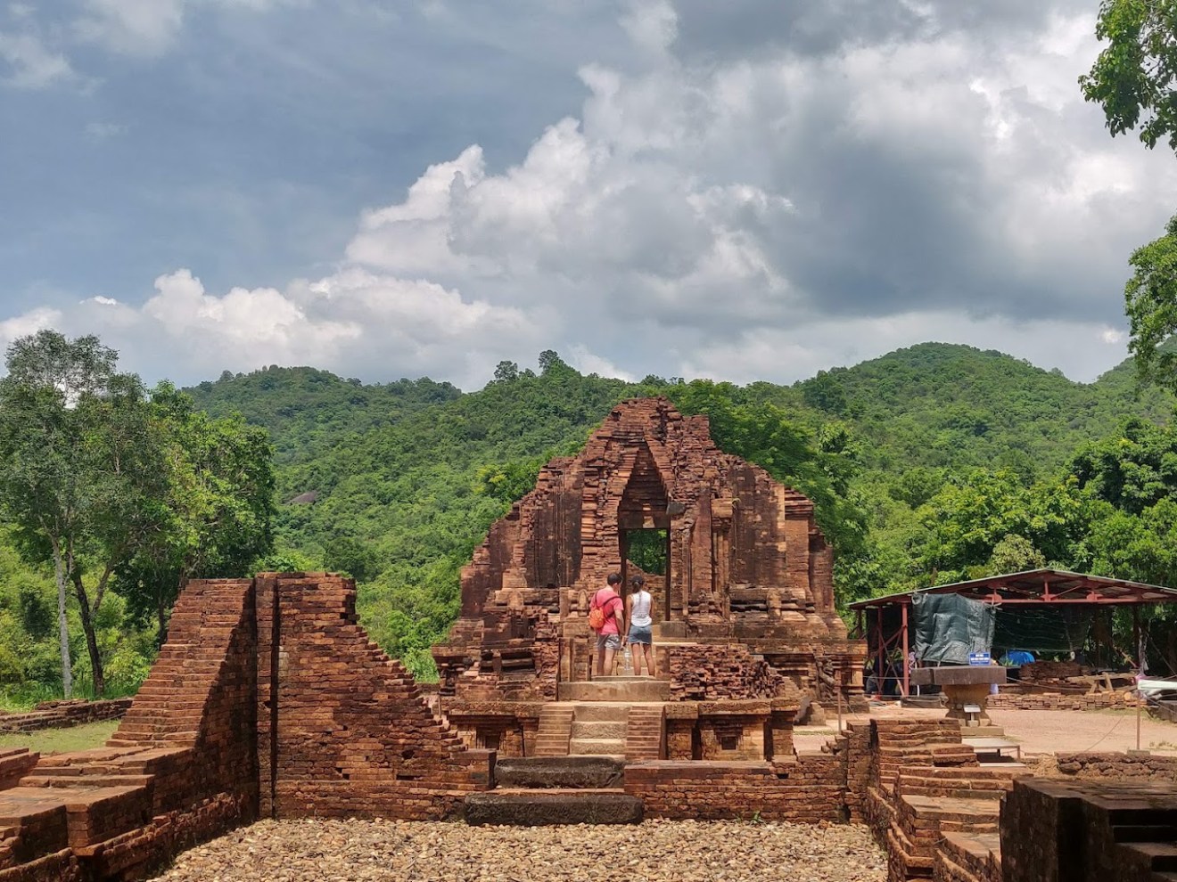 a tower with a mountain in the background
