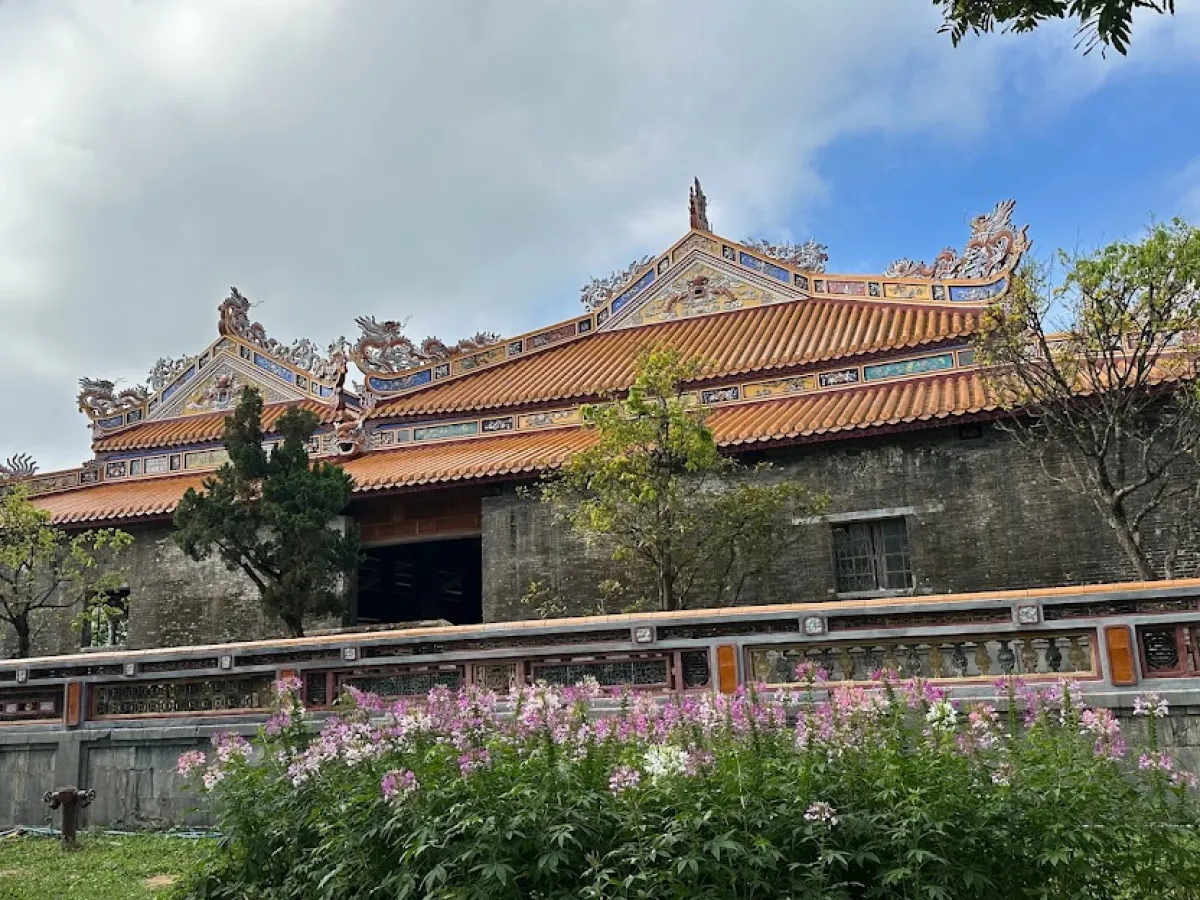 a house with bushes in front of a building