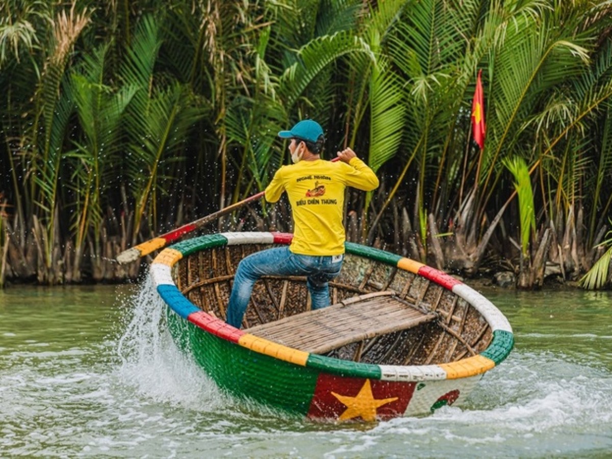 a person riding on the back of a boat in the water