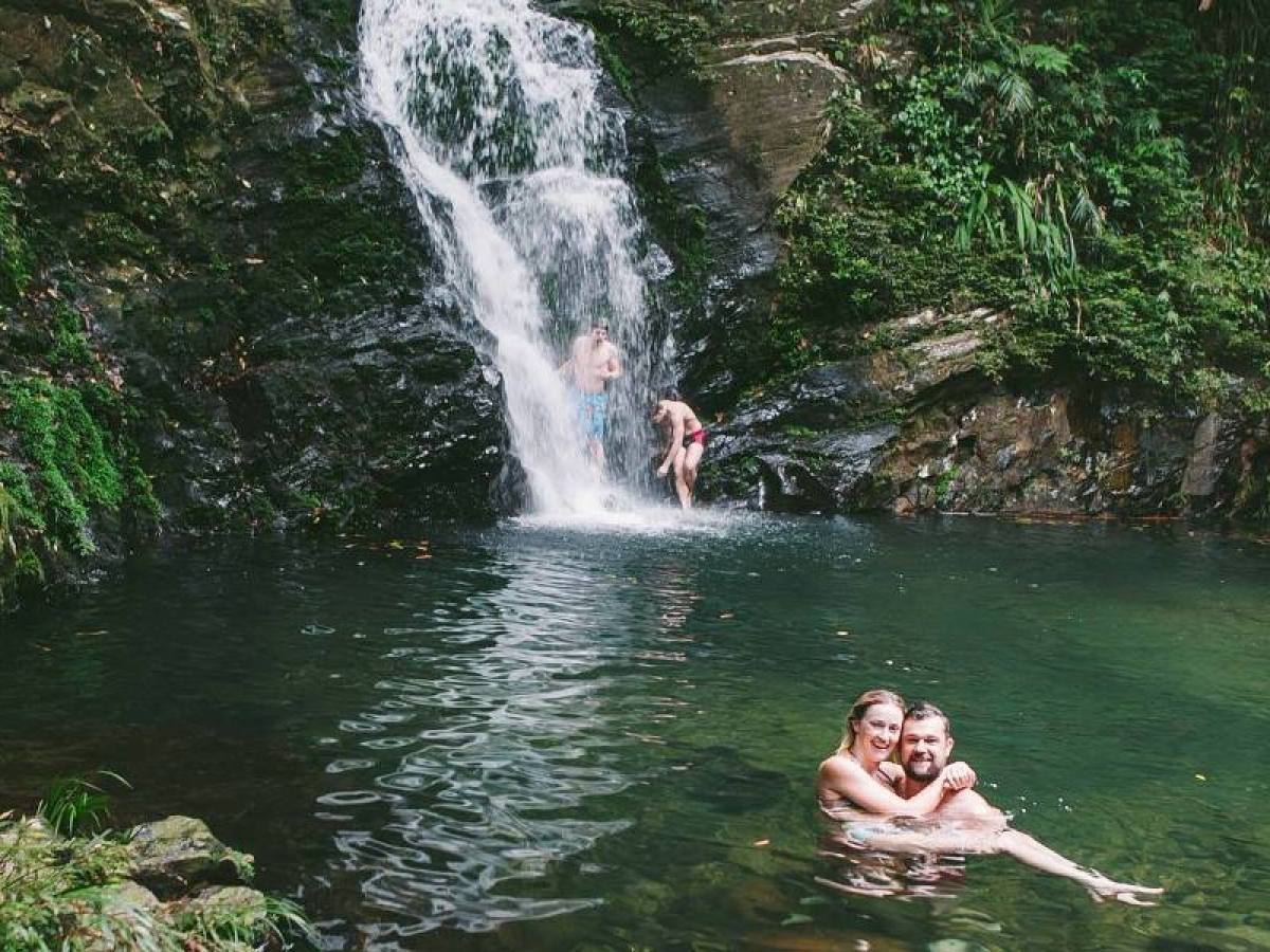 a waterfall going over a body of water