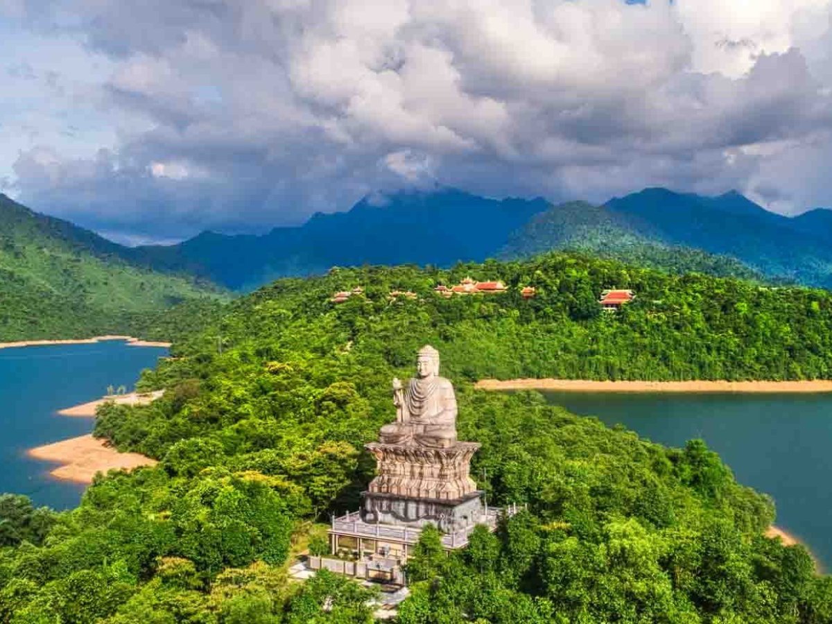 a large body of water with a mountain in the background